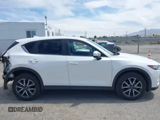 2018 Mazda CX-5 Touring with VIN JM3KFACM3J0381122, listed as a IAAI auction lot 42023838 with 76,121 mi miles. Bid and sale history available at carsss.com. Image 13.