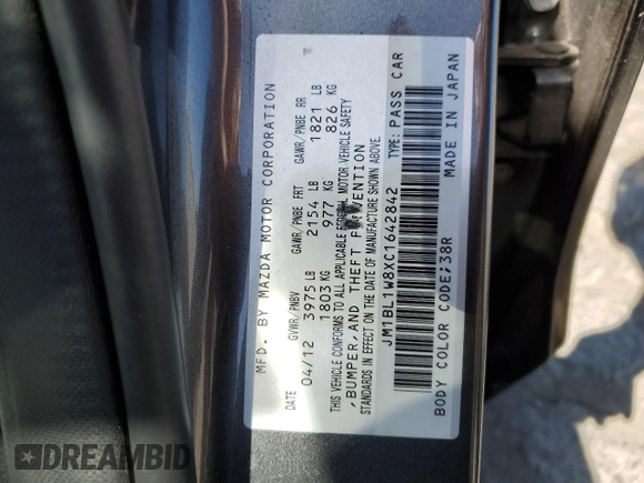 2012 Mazda 3 i Grand Touring with VIN JM1BL1W8XC1642842, listed as a Copart auction lot 57833245 with 104,914 mi miles and Salvage title. Bid and sale history available at DreamBid. Image 12.