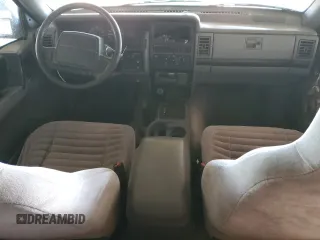 1995 Jeep Grand Cherokee Laredo with VIN 1J4GZ58S1SC704775, listed as a Copart auction lot 87556535 with 266,365 mi miles and Salvage Title. Bid and sale history available at carsss.com. Image 8.