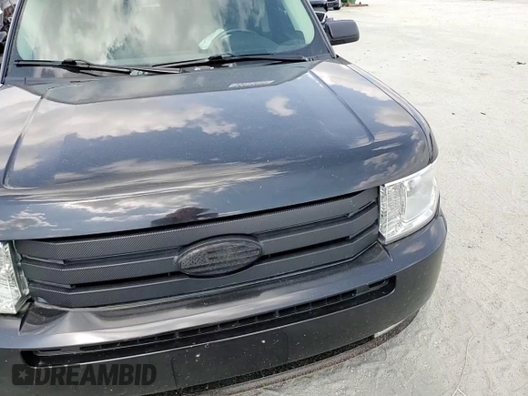 2012 Ford Flex SE z VIN 2FMGK5BC4CBD22541, wystawiony jako Copart lot #55414435 z przebiegiem 142 900 mil mil oraz Szkody całkowita. Historia ofert i sprzedaży dostępna na DreamBid. Obrazek 14.