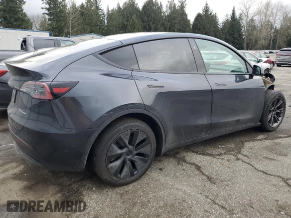 2025 Tesla Model Y Long Range with VIN 7SAYGDEE5SF296652, listed as a Copart auction lot 46664465 with 452 mi miles and Salvage Title. Bid and sale history available at DreamBid. Image 3.