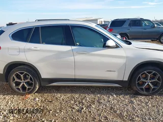 2018 BMW X1 sDrive28i with VIN WBXHU7C36J5H41267, listed as a IAAI auction lot 41270207 with 84,726 mi miles. Bid and sale history available at carsss.com. Image 13.