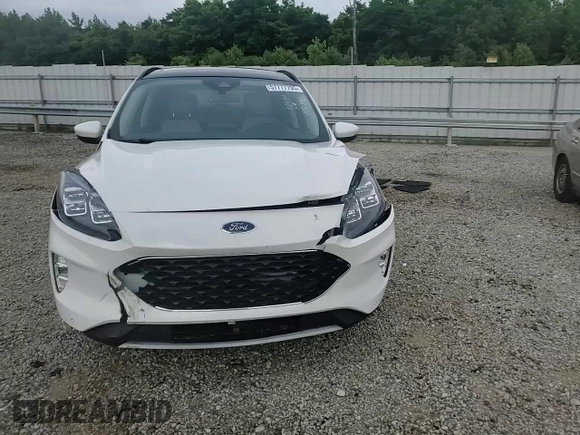 2020 Ford Escape Titanium z VIN 1FMCU9J9XLUB57675, wystawiony jako Copart lot #57777795 z przebiegiem Nie podano mil oraz Szkoda całkowita • Salvage title. Historia ofert i sprzedaży dostępna na DreamBid. Obrazek 14.
