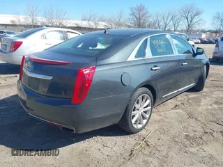 2013 Cadillac XTS Luxury with VIN 2G61R5S32D9223380, listed as a IAAI auction lot 41881602 with 335,780 mi miles. Bid and sale history available at carsss.com. Image 4.