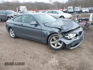 2014 BMW 4 Series 428i xDrive with VIN WBA3N9C50EK246002, listed as a IAAI auction lot 41612256 with 100,915 mi miles and . Bid and sale history available at carsss.com. Image 1.