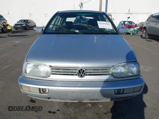 1999 Volkswagen Golf z VIN 3VWJA81HXXM215507, wystawiony jako IAAI lot #41391464 z przebiegiem 167 875 mil mil oraz . Historia ofert i sprzedaży dostępna na DreamBid. Obrazek 12.