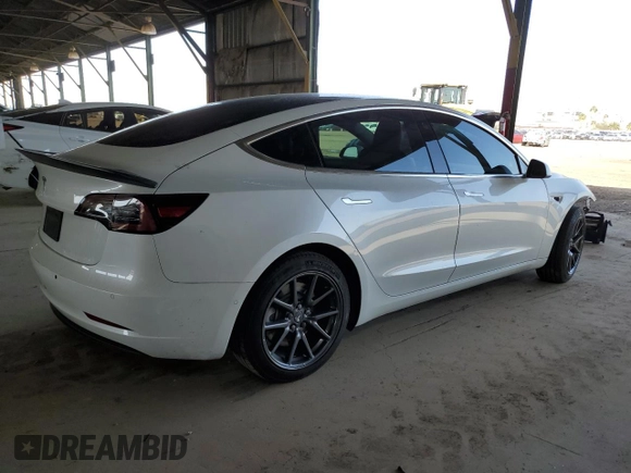 2020 Tesla Model 3 Standard Range Plus with VIN 5YJ3E1EA6LF645215, listed as a Copart auction lot 47882375 with 69,317 mi miles and Salvage Title. Bid and sale history available at DreamBid. Image 3.