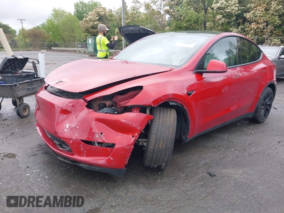 2021 Tesla Model Y Long Range with VIN 5YJYGDEE5MF085032, listed as a IAAI auction lot 41982925 with 64,541 mi miles and . Bid and sale history available at DreamBid. Image 2.