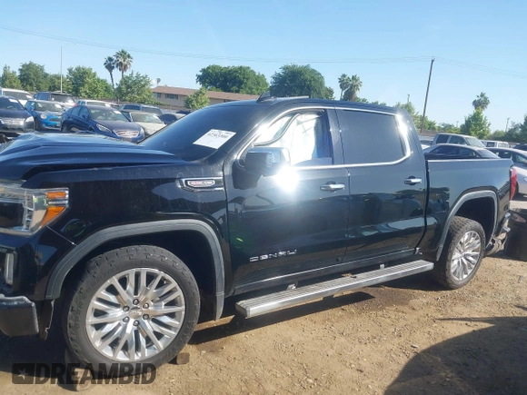 2019 GMC Sierra 1500 Denali z VIN 1GTU9FEL8KZ173809, wystawiony jako IAAI lot #42363300 z przebiegiem 75 425 mil mil oraz . Historia ofert i sprzedaży dostępna na DreamBid. Obrazek 15.