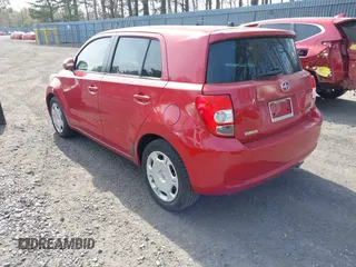 2010 Scion xD with VIN JTKKU4B43A1004049, listed as a IAAI auction lot 42088528 with 98,360 mi miles. Bid and sale history available at carsss.com. Image 3.