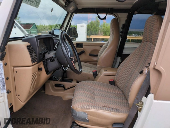 1999 Jeep Wrangler Sport with VIN 1J4FY19S2XP421162, listed as a Copart auction lot 57683835 with 152,636 mi miles and Salvage title. Bid and sale history available at DreamBid. Image 7.