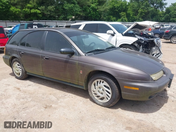 1999 Saturn SW z VIN 1G8ZK8270XZ189484, wystawiony jako IAAI lot #42265580 z przebiegiem 142 257 mil mil oraz . Historia ofert i sprzedaży dostępna na DreamBid. Obrazek 1.