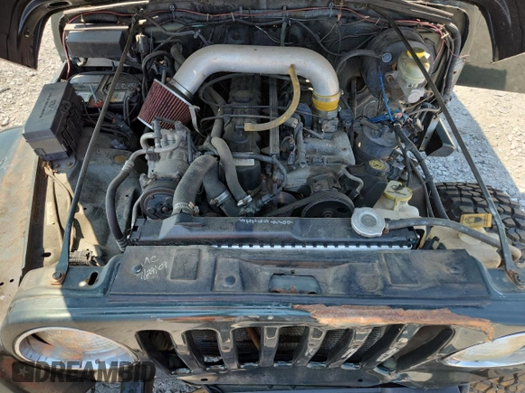 1997 Jeep Wrangler Sahara with VIN 1J4FY49S3VP519387, listed as a Copart auction lot 63822395 with 187,884 mi miles and Salvage title. Bid and sale history available at DreamBid. Image 12.