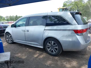 2014 Honda Odyssey Touring with VIN 5FNRL5H97EB054158, listed as a IAAI auction lot 42548360 with 91,161 mi miles and . Bid and sale history available at DreamBid. Image 14.
