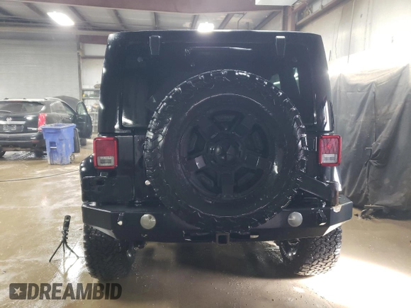 2015 Jeep Wrangler Unlimited Rubicon Hard Rock with VIN 1C4HJWFG4FL676868, listed as a Copart auction lot 48489525 with 100,771 mi miles and Salvage title. Bid and sale history available at DreamBid. Image 6.
