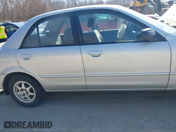 2000 Mazda Protege DX with VIN JM1BJ2227Y0240819, listed as a IAAI auction lot 41810228 with 68,650 mi miles and . Bid and sale history available at DreamBid. Image 13.