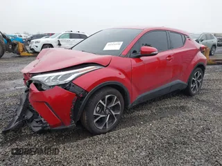 2021 Toyota C-HR LE with VIN JTNKHMBX1M1104530, listed as a IAAI auction lot 41324350 with 53,112 mi miles. Bid and sale history available at carsss.com. Image 2.