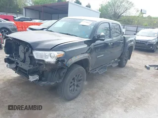 2023 Toyota Tacoma 4WD SR with VIN 3TYCZ5AN4PT170688, listed as a IAAI auction lot 41998053 with 20,770 mi miles. Bid and sale history available at carsss.com. Image 2.