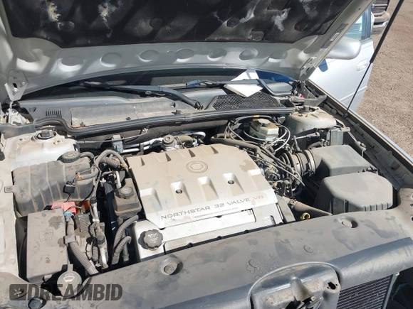 2003 Cadillac DeVille DTS z VIN 1G6KF57923U260229, wystawiony jako IAAI lot #41415468 z przebiegiem 58 012 mil mil oraz . Historia ofert i sprzedaży dostępna na DreamBid. Obrazek 10.