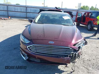 2017 Ford Fusion SE z VIN 3FA6P0H70HR198507, wystawiony jako IAAI lot #42033338 z przebiegiem 94 363 mil mil oraz . Historia ofert i sprzedaży dostępna na DreamBid. Obrazek 6.