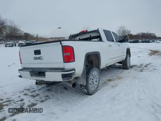 2015 GMC Sierra 2500HD available WiFi Denali with VIN 1GT120E88FF680538, listed as a IAAI auction lot 41571684 with 125,147 mi miles. Bid and sale history available at carsss.com. Image 4.