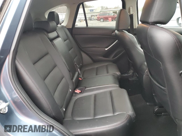 2016 Mazda CX-5 Grand Touring with VIN JM3KE4DY7G0761594, listed as a Copart auction lot 51514595 with 58,250 mi miles and Salvage Title. Bid and sale history available at DreamBid. Image 11.