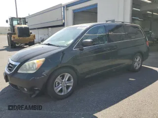 2010 Honda Odyssey Touring with VIN 5FNRL3H9XAB067890, listed as a Copart auction lot 63520575 with 213,582 mi miles and Clean title. Bid and sale history available at DreamBid. Image 1.