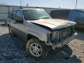 1997 Jeep Grand Cherokee Laredo with VIN 1J4GZ58S5VC561060, listed as a Copart auction lot 52098315 with 267,245 mi miles and Salvage title. Bid and sale history available at DreamBid. Image 12.
