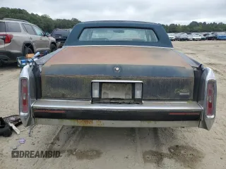 1990 Cadillac Brougham z VIN 1G6DW5472LR719564, wystawiony jako Copart lot #71634744 z przebiegiem Nie podano mil oraz Tytuł czysty. Historia ofert i sprzedaży dostępna na DreamBid. Obrazek 6.