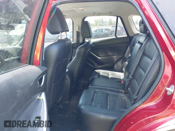 2016 Mazda CX-5 Grand Touring z VIN JM3KE2DY2G0660385, wystawiony jako IAAI lot #42101004 z przebiegiem 166 336 mil mil oraz . Historia ofert i sprzedaży dostępna na DreamBid. Obrazek 8.