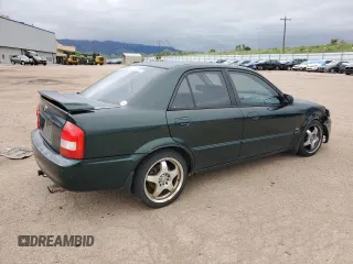 2002 Mazda Protege LX z VIN JM1BJ226920510014, wystawiony jako Copart lot #59285995 z przebiegiem 235 652 mil mil oraz Szkoda całkowita • Salvage title. Historia ofert i sprzedaży dostępna na DreamBid. Obrazek 3.