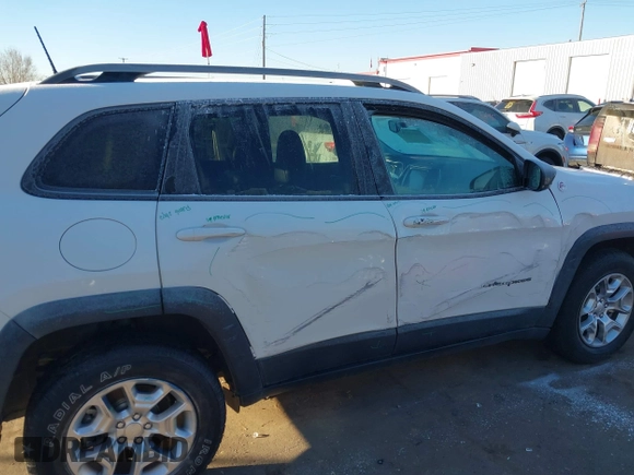 2019 Jeep Cherokee Trailhawk with VIN 1C4PJMBX8KD313712, listed as a IAAI auction lot 41448146 with 96,293 mi miles and . Bid and sale history available at DreamBid. Image 16.