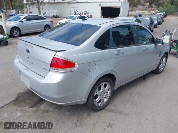 2008 Ford Focus SE with VIN 1FAHP35N18W199448, listed as a IAAI auction lot 42088860 with 174,391 mi miles. Bid and sale history available at carsss.com. Image 4.