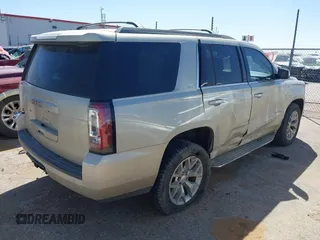 2015 GMC Yukon SLT with VIN 1GKS1BKC1FR145694, listed as a IAAI auction lot 41851644 with 162,592 mi miles. Bid and sale history available at carsss.com. Image 4.