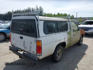 1987 Nissan Hardbody E z VIN JN6ND11S1HW047821, wystawiony jako IAAI lot #42210912 z przebiegiem 162 721 mil mil oraz . Historia ofert i sprzedaży dostępna na DreamBid. Obrazek 4.
