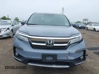 2022 Honda Pilot Touring 7-Passenger with VIN 5FNYF6H68NB056077, listed as a IAAI auction lot 42357338 with 18,193 mi miles and . Bid and sale history available at DreamBid. Image 12.