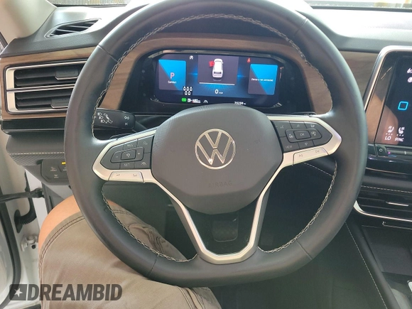 2024 Volkswagen Atlas SE with VIN 1V2HR2CA2RC556331, listed as a IAAI auction lot 42806429 with 25,239 mi miles and . Bid and sale history available at DreamBid. Image 2.