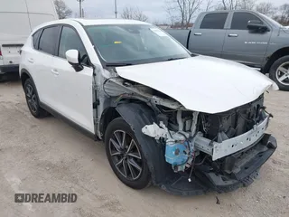 2018 Mazda CX-5 Touring z VIN JM3KFBCM6J0323107, wystawiony jako IAAI lot #41895519 z przebiegiem 86 124 mil mil oraz . Historia ofert i sprzedaży dostępna na DreamBid. Obrazek 1.