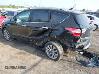 2018 Ford Escape Titanium with VIN 1FMCU9J95JUB30803, listed as a IAAI auction lot 42286536 with 63,309 mi miles and . Bid and sale history available at DreamBid. Image 3.