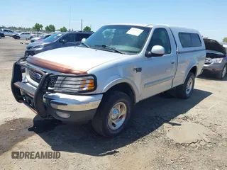 2000 Ford F-150 XL z VIN 1FTRF18L1YKA63179, wystawiony jako IAAI lot #42532771 z przebiegiem 116 604 mil mil oraz . Historia ofert i sprzedaży dostępna na DreamBid. Obrazek 2.