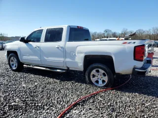2016 Chevrolet Silverado 1500 LT with VIN 3GCUKREC5GG247586, listed as a Copart auction lot 49600245 with 218,489 mi miles and Salvage Title. Bid and sale history available at DreamBid. Image 2.