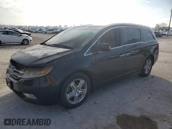 2012 Honda Odyssey Touring with VIN 5FNRL5H9XCB022284, listed as a Copart auction lot 82766824 with Not provided miles and Salvage title. Bid and sale history available at DreamBid. Image 1.
