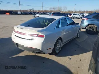 2016 Lincoln MKZ z VIN 3LN6L2JK8GR624664, wystawiony jako IAAI lot #41774444 z przebiegiem 106 695 mil mil oraz . Historia ofert i sprzedaży dostępna na DreamBid. Obrazek 4.