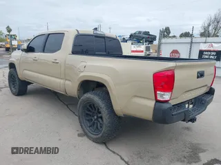 2016 Toyota Tacoma SR5 with VIN 3TMDZ5BN3GM003351, listed as a IAAI auction lot 41721932 with 100,774 mi miles and . Bid and sale history available at DreamBid. Image 3.