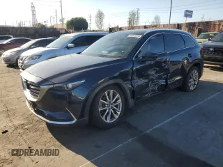 2018 Mazda CX-9 Grand Touring z VIN JM3TCADY3J0207176, wystawiony jako Copart lot #50222325 z przebiegiem 76 856 mil mil oraz Szkoda całkowita • Salvage title. Historia ofert i sprzedaży dostępna na DreamBid. Obrazek 1.