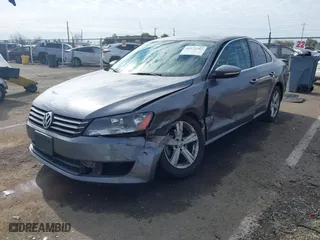 2012 Volkswagen Passat SE with VIN 1VWBP7A35CC024137, listed as a IAAI auction lot 41572782 with 138,827 mi miles. Bid and sale history available at carsss.com. Image 2.
