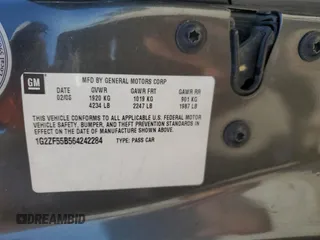 2006 Pontiac G6 1SV z VIN 1G2ZF55B564242284, wystawiony jako Copart lot #79663764 z przebiegiem Nie podano mil oraz Szkoda całkowita • Salvage title. Historia ofert i sprzedaży dostępna na DreamBid. Obrazek 14.