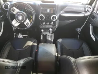 2015 Jeep Wrangler Unlimited Sahara with VIN 1C4BJWEG6FL614671, listed as a Copart auction lot 86052284 with 92,894 mi miles and Salvage title. Bid and sale history available at DreamBid. Image 8.