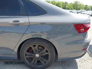 2021 Volkswagen Jetta GLI S z VIN 3VW6T7BU9MM052902, wystawiony jako IAAI lot #42286711 z przebiegiem 91 519 mil mil oraz . Historia ofert i sprzedaży dostępna na DreamBid. Obrazek 12.