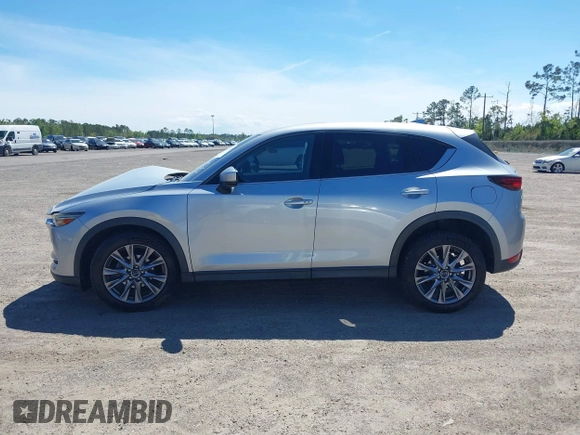 2019 Mazda CX-5 Grand Touring with VIN JM3KFADM1K1606082, listed as a IAAI auction lot 41875878 with 66,089 mi miles. Bid and sale history available at carsss.com. Image 14.